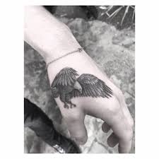 Bird Tattoo On Hand For Boys Single Needle Eagle Tattoo On Brooklyn Beckham S Left Hand Hand Tattoos Hand Tattoos For Guys Small Hand Tattoos