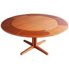 A simple and modern dining table that allows you to extend it using only one hand. Expandable Danish Teak Lotus Dining Table By Dyrlund 1stdibs Com Dining Table Round Extendable Dining Table Wooden Dining Tables