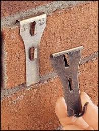 Tuesday S Tips The Trick To Hanging Pics On Brick Walls Brick Clips Home Diy Home Projects