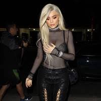Kylie jenner wore a mesh bodysuit to justin bieber's album release party. Kylie Jenner Fashion And Outfits From Double Denim To Booty Shorts Glamour Uk