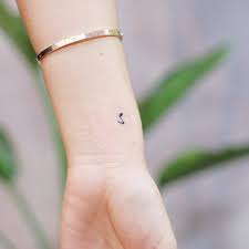 Swanky musicnote tattoo on upper back. Music Note Tattoo On The Wrist