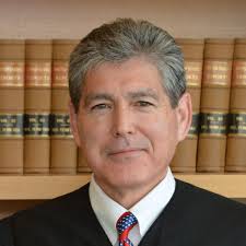 Who is Dana Sabraw, the judge behind the family reunification case?