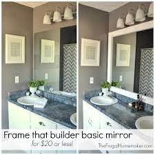 This tile went on without any grout and matched the blue bathroom. How To Frame Out That Builder Basic Bathroom Mirror For 20 Or Less The Frugal Homemaker