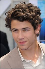 Angled brush back with high fade 15 Best Hairstyles For Teenage Guys With Curly Hair