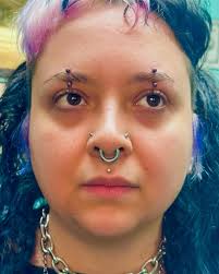 sammii.cakes wanted paired centered eyebrow piercings, so I made it happen.  These were done with 14g implant grade titanium curved barbells anodized to  a lovely magenta to match their vibe. Thanks for