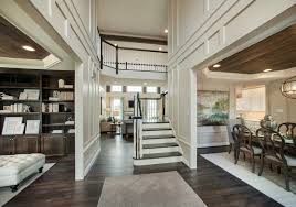 I give you some great ideas that will give you something to help start your creative juices flowing. A Dramatic Foyer Opens To The Study Dining Room And Second Floor A New Home By W B Homes In The Vistas At Highland Ridge Comm Home New Homes Interior Design