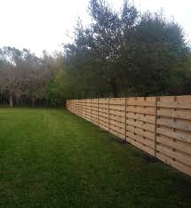 These attractive privacy fence panels appear almost corrugated; Wood Fences Port Charlotte Fl Cypress Fence Installation Sarasota Fl