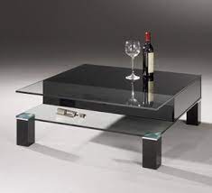 Easy to assemble and easy to style, the tempered glass top, metal shelf and blackened bronze finish make it the perfect addition to your living room or den ensemble. Buy A Black Glass Coffee Table In Modern Design Dreieck Design