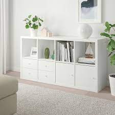 When your living room is also your bedroom, you need smart storage solutions. Kallax Shelving Unit With 4 Inserts High Gloss White Ikea