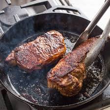 Heat the olive oil in a cast iron skillet until very hot. Cast Iron Steaks With Blue Cheese Chive Butter Cook S Illustrated