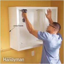 Installing Kitchen Cabinets Nbsp How To Install Kitchen Cabinets Installing Kitchen In 2020 Installing Cabinets Installing Kitchen Cabinets Hanging Kitchen Cabinets