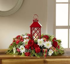 The artificial christmas centerpiece is made of silk flowers and vase. The Ftd Celebrate The Season Centerpiece 17 C3s In Central Square Ny Leaf Stem