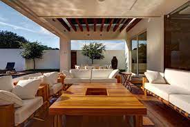 Choose the essential pieces (wirework round table, umbrella, stools) in a contemporary gray and white color scheme. What Is The Best Way To Decorate An Outdoor Space Mastella Magazine