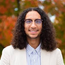 Next up in our Scholar Spotlight: Meet Tyler, one of our inaugural Impact  Scholarship awardees! Tyler is a pre-med student majoring in Global Public  Health. He is vice president of First of