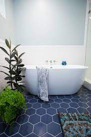 Master Bathroom Renovation Before After The Effortless Chic Master Bathroom Renovation Tile Bathroom Bathroom Floor Tiles