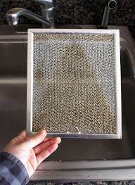 How To Clean A Greasy Range Hood Filter Cleaning Hacks House Cleaning Tips Deep Cleaning Tips