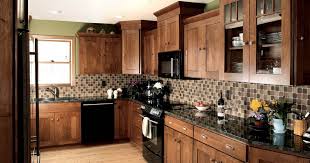 Stained Kitchen Cabinets In Autumn With Ebony Glaze By Showplace Cabinetry Feature Country Kitchen Stained Kitchen Cabinets Kitchen Design