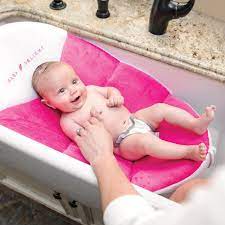 The cushioned seat pad easily removes to hang dry. Baby Delight Cushy Nest Cloud Pink Gulfbird