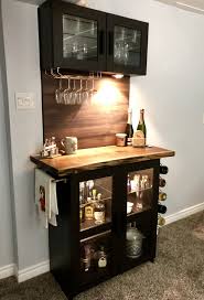 To create a basement bar that is cohesive with the rest of the house, try using the same style of cabinetry that you have in your kitchen. It S Complete Black Walnut Slab Sanded And Tung Oiled Brimnes Cabinet And Uppers Bought Some Rubber Adhesive Home Bar Cabinet Home Bar Decor Home Bar Rooms