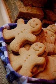 Four gingerbread men, three dessed as santa and one as snowman. Gingerbread Man Wikipedia