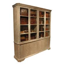 The sideboard table comes complete with four storage drawers, two cabinets, and a bottom shelf. Chamberet French Country Distressed Grey 4 Door Bookcase Cabinet Tall Over 90 H Kathy Kuo Home