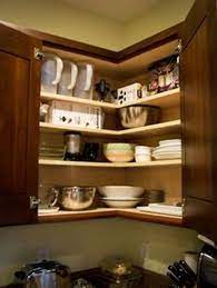 Separate your cabinets to have your daily items within arm's reach, your weekly ones a little higher up, and the rest on your top shelves. How To Organize Deep Corner Kitchen Cabinets 5 Tips For Functional Look Home Improvement Day