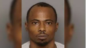 Man charged after he allegedly ran red light in stolen truck