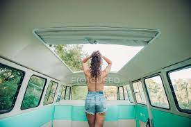 A finger tugged at the elastic of the garter belt, highlighting how tight that whole outfit was on him. Back View Of Topless Woman With Curly Hair Standing Under Hatch Inside Retro Van In Nature Shorts Three Quarter Stock Photo 222719568
