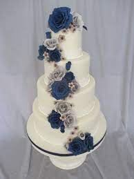 For more beautiful navy wedding ideas, check out all our top tips and advice. Navy And Gray Wedding Cake Fondant Covered With Gum Paste Flowers Fondant Wedding Cakes Purple Wedding Cakes Fall Wedding Cakes