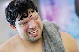 Legally blind fitness trainer preparing for national triathlon