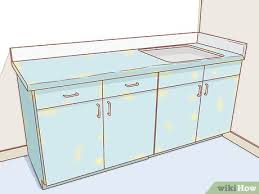 Before you can paint your cabinets, the doors, drawers and hardware must be removed. 3 Ways To Paint Kitchen Cupboards Wikihow