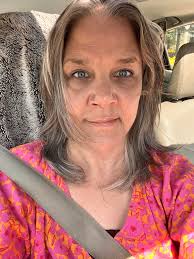 Who can style my hair with braids and curls for an event in Lansing, MI