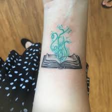 Book Tattoo Magic Imagination Tattoos Book Tattoo Paw Print Tattoo