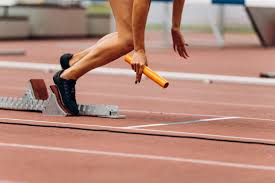 A baton handoff during a 4x200 relay race at the battleground relays track meet. Relay Baton Photos Royalty Free Images Graphics Vectors Videos Adobe Stock