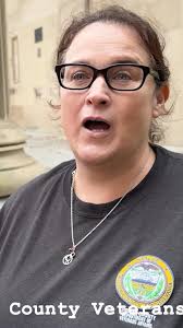 Mayor Phil Dague begins the No Kings protest organized by Indivisible  Chester County in West Chester, PA. After talking about the goals of the  day, he introduces Rev. Josh Gill, a local