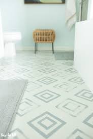 Taped off edges, trim, and bottom of fridge. Diy Painted Linoleum Bathroom Floor House By Hoff