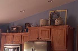 Retro kitchen cabinets reflecting this era are often done in bold, bright colors such as red, blue or green. Old Window And Crocks Above Kitchen Cabinets Above Kitchen Cabinets Kitchen Cabinets Decor Decorating Above Kitchen Cabinets