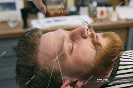 Threading is an alternative to waxing or plucking. Traditional Facial Hair Threading Saloon Beard Stock Photo 126872722