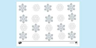 The coloring sheet features a huge snowflake surrounded by small snowflakes on each side. Free Small Snowflake Colouring Pages Colouring Sheets