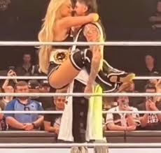 Liv and Dom showing their affection last night during the dark match after  SmackDown : rWrasslin