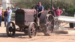 Closeup of red painted antique tractor wheel with steel cleats. 1928 Mccormick Deering 15 30 On Steel Wheels Pulling The Sled At Glendale Az 2 8 14 Youtube