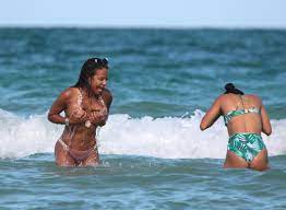 Christina Milian's boobs almost pop out of her bikini as she is wiped out  by a wave on the beach in Miami with Karrueche Tran | The Irish Sun