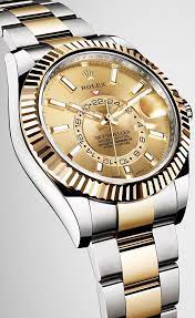 On The Yellow Rolesor Version Of The New Sky Dweller The Fluted Bezel The Winding Crown And The Cent Rolex Watches Stylish Watches Men Luxury Watches For Men