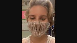 As photos and videos posted to del rey's own instagram show, the singer opted to wear a mesh face mask. Lana Del Rey Criticized For Wearing Mesh Face Mask Consequence Of Sound