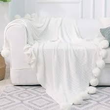 Making the pom pom throw blanket all started when a certain new member of my household took over my warm and snuggly leopard throw. Dokot Knitted Throw Blanket With Pom Poms Cotton For Sofa Bedding Couch Cover White 59 X 79 Buy Online In Antigua And Barbuda At Antigua Desertcart Com Productid 39460028