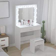 If you wear makeup, having a good makeup vanity with adjustable lighting is very nearly a must. Ebern Designs Vanity Set With Lighted Mirror Cushioned Stool Dressing Table Makeup Table Wayfair