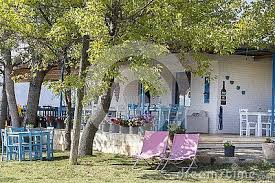 A Pleasant And Charming Mediterranean Wine Restaurant Waits For Customers With Empty Blue Chairs And Tables Two Pink D Outdoor Decor Mediterranean Garden Arch