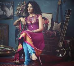Anoushka Shankar Wallpaper Download To Your Mobile From Phoneky Anime woman wearing crop top and red shorts leaning on wall wallpaper.
