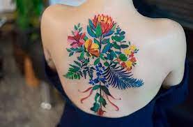 However, when flowers are designed to be the star of the show, they are often seen in a bouquet, inside a vase or having a hand holding them. Illustrative Flower Bouquet Tattoo On The Back