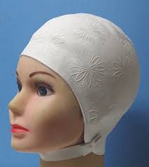 What was the style of swim caps in the early 70's?